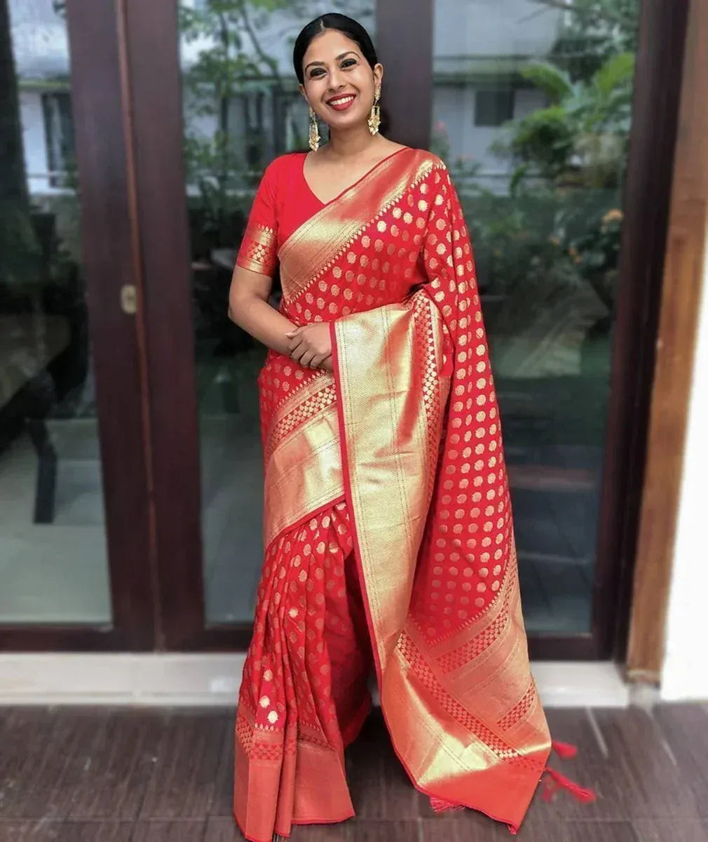 Red and gold designer saree with polka dot pattern, perfect for ethnic occasions