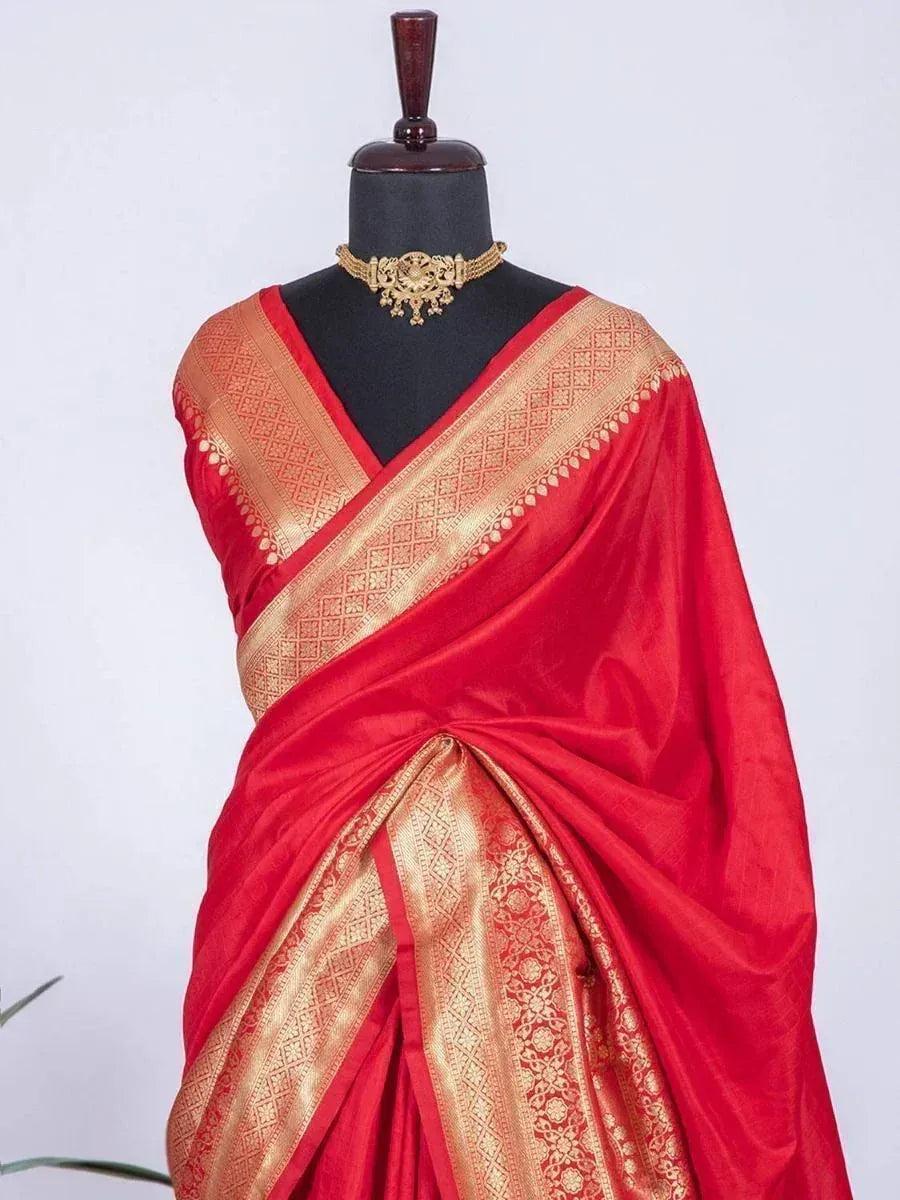 Red silk saree with gold zari border, styled with traditional necklace for Indian ethnic wear