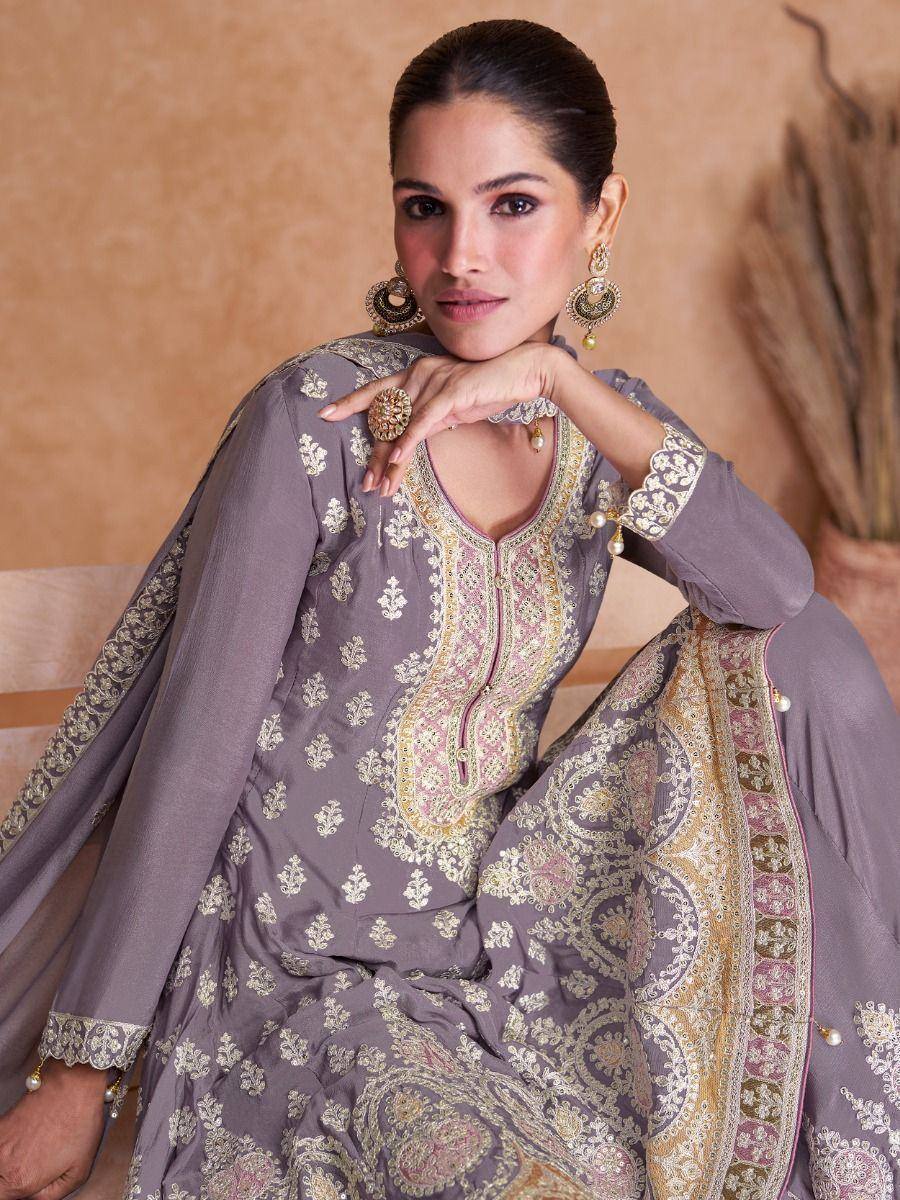 Elegant grey embroidered salwar kameez with gold and pink detailing, perfect for ethnic occasions.