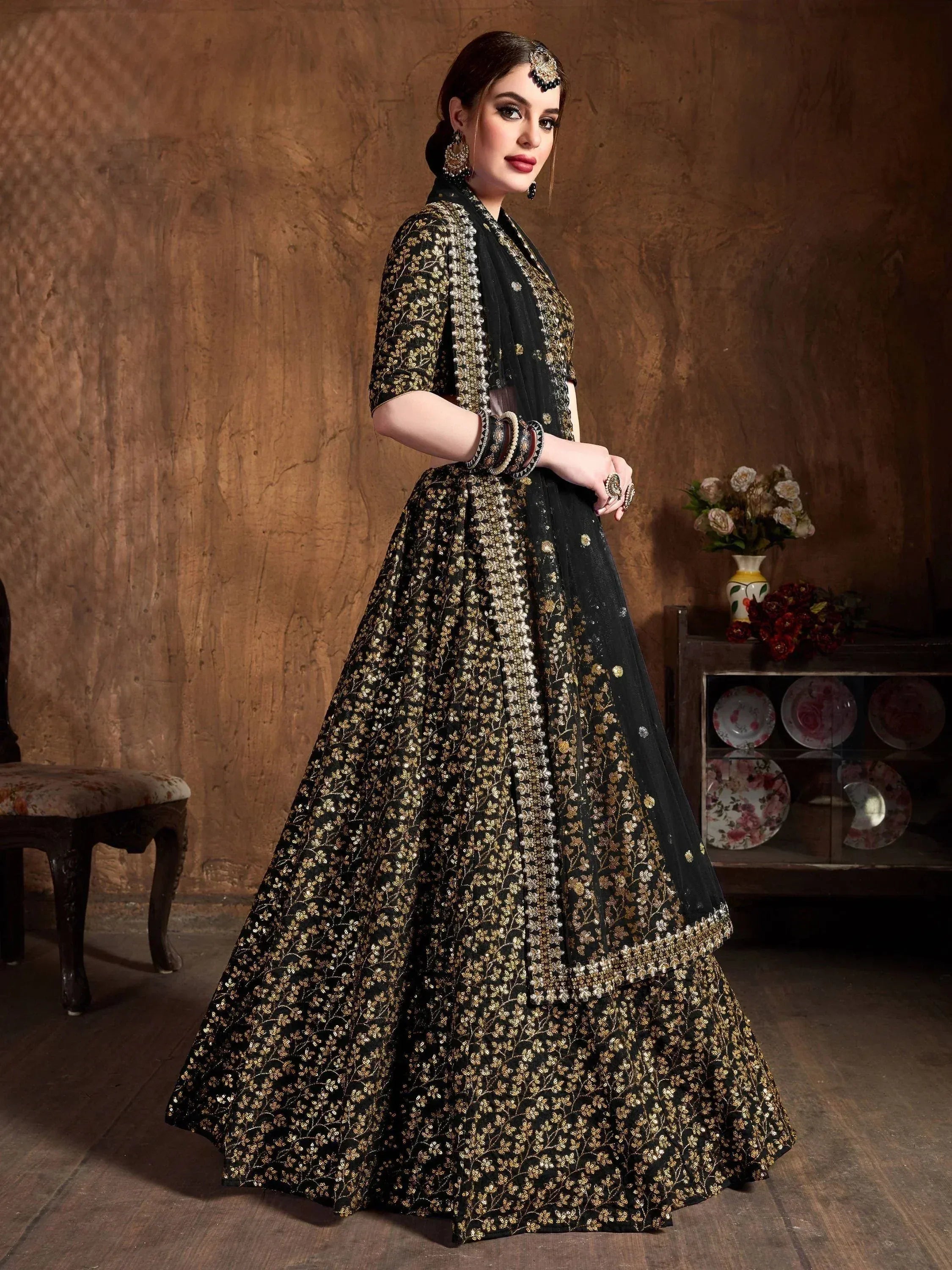Black and gold embroidered lehenga choli with floral sequin work, perfect for Indian ethnic wear occasions