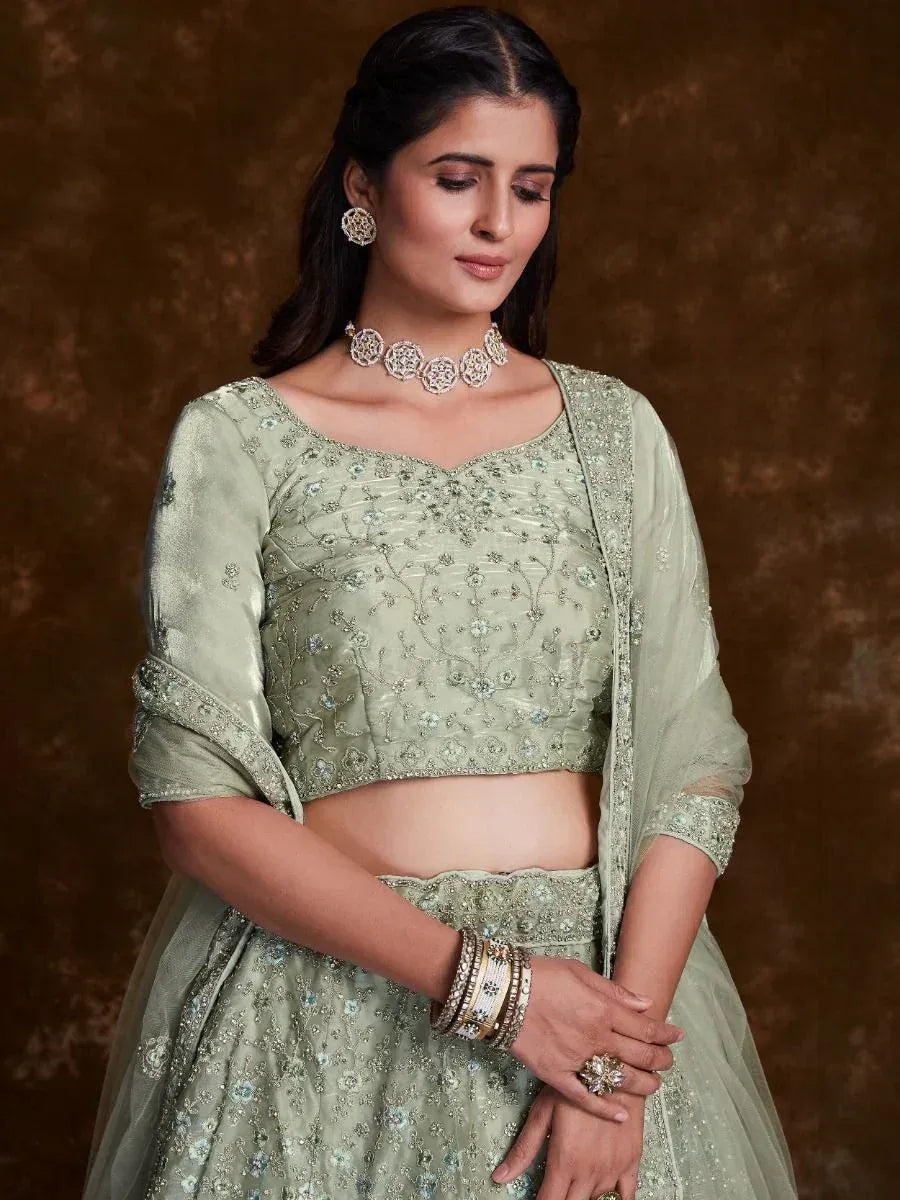 Mint green embroidered lehenga choli with floral motifs, perfect for Indian ethnic wear occasions