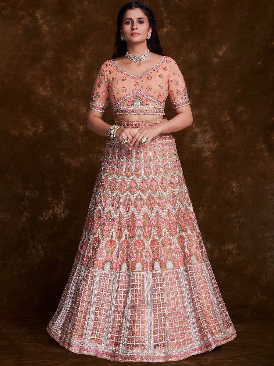 Pink embroidered lehenga choli with floral motifs, perfect for Indian weddings and festive occasions.