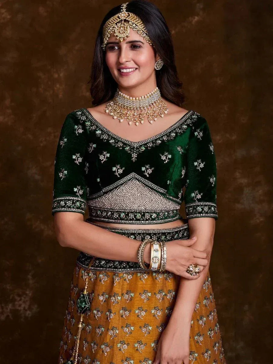 Green velvet lehenga choli with gold embroidery, traditional Indian ethnic wear for women