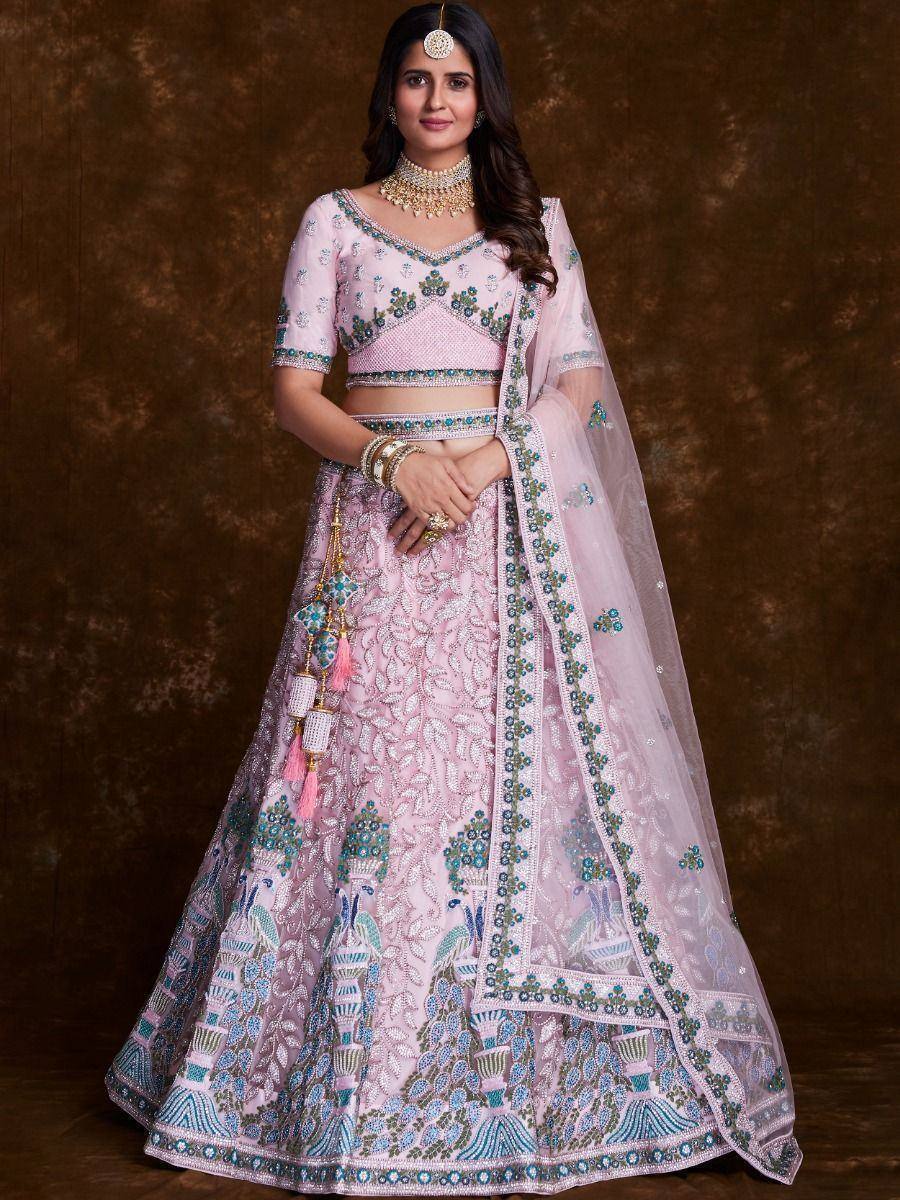 Pink embroidered lehenga choli with peacock motifs, perfect for Indian weddings and festive occasions