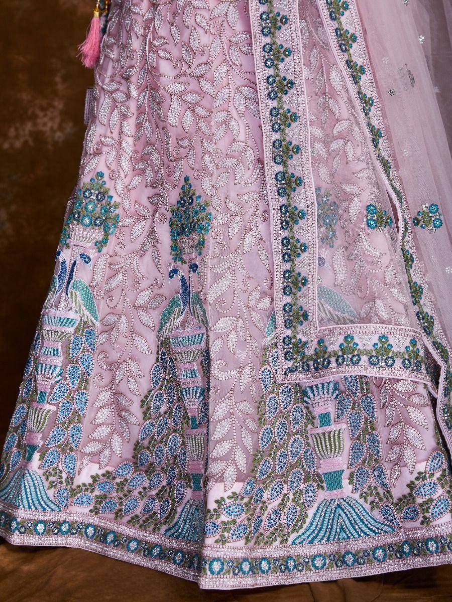 Pink lehenga with peacock embroidery and blue floral motifs, designer Indian ethnic wear