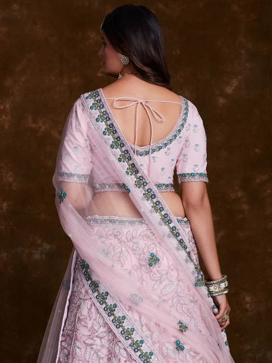 Pink designer lehenga choli with blue embroidery, back tie blouse, and sheer dupatta for Indian ethnic wear