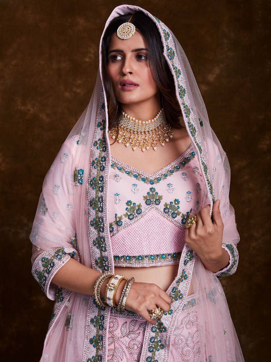 Pink embroidered lehenga choli with dupatta, perfect for Indian weddings and festive occasions