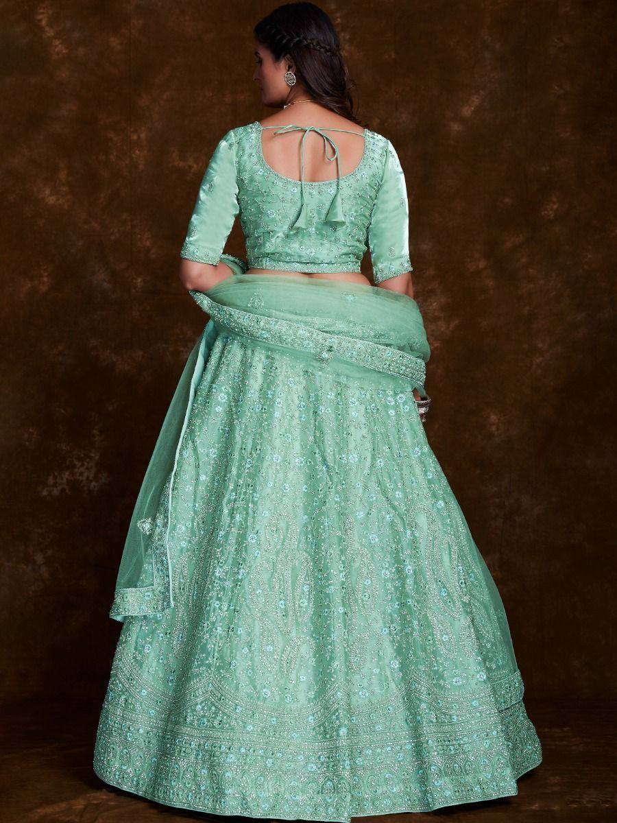 Mint green designer lehenga choli with intricate embroidery and back tie blouse, perfect for Indian ethnic wear occasions
