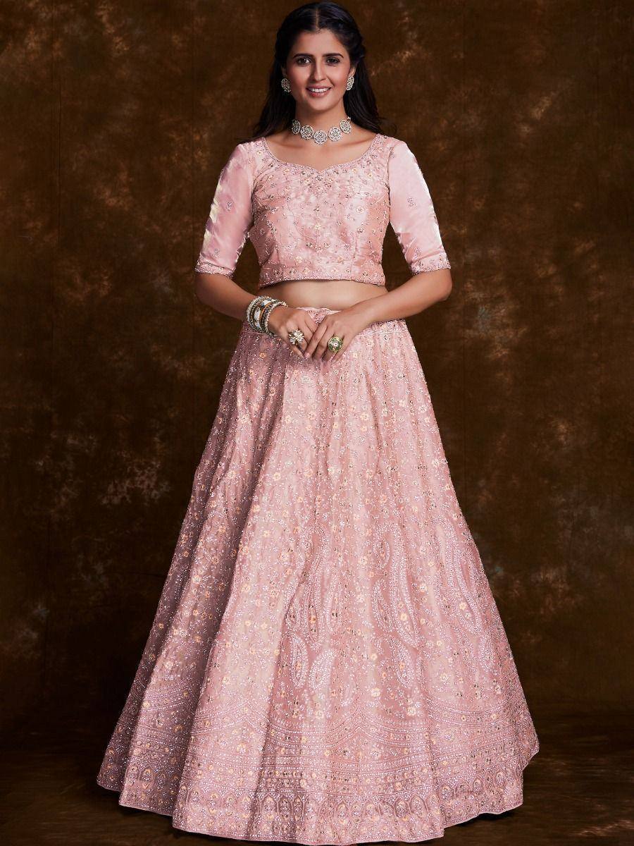 Pink embroidered lehenga choli with floral motifs, perfect for Indian ethnic wear and festive occasions.
