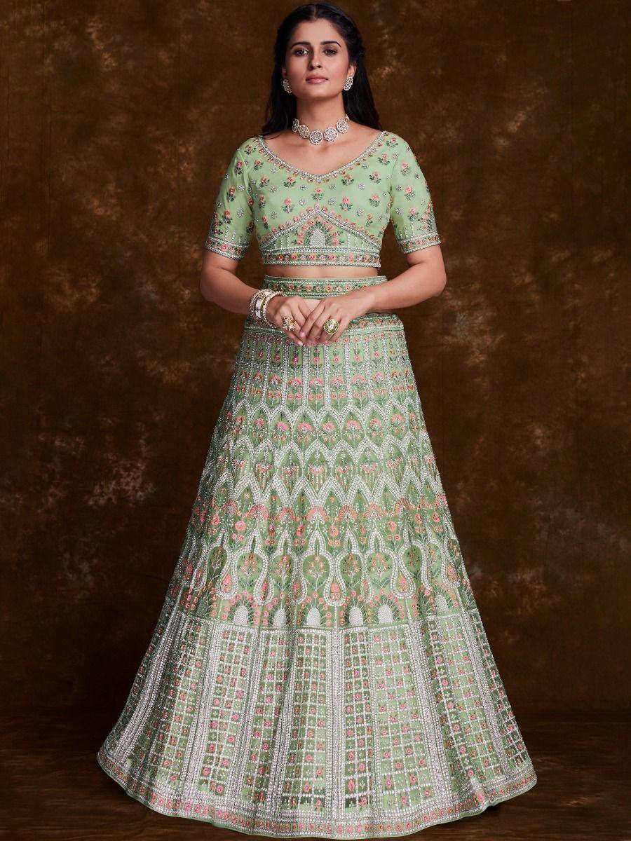 Mint green embroidered lehenga choli with floral and geometric patterns, perfect for Indian ethnic wear occasions.