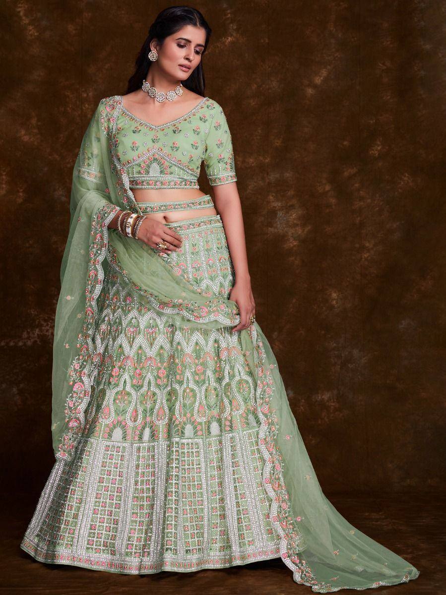 Mint green embroidered lehenga choli with floral motifs and dupatta, perfect for Indian weddings and festive occasions.