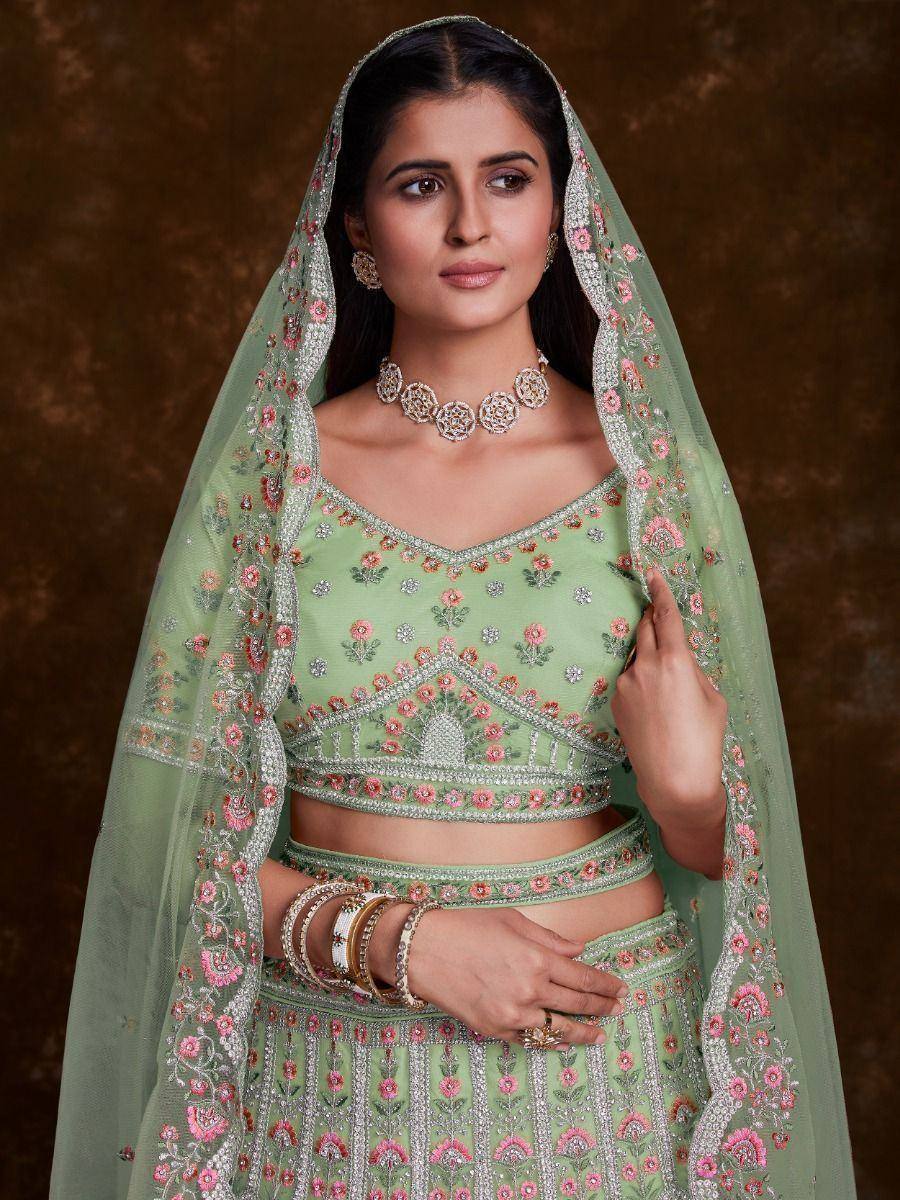 Mint green embroidered lehenga choli with floral dupatta, perfect for Indian weddings and festive occasions.