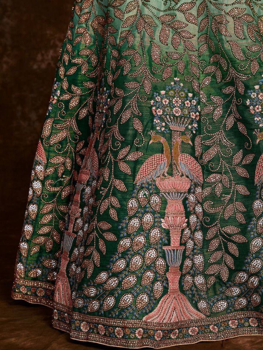 Green designer lehenga with intricate peacock and floral embroidery, perfect for ethnic occasions.