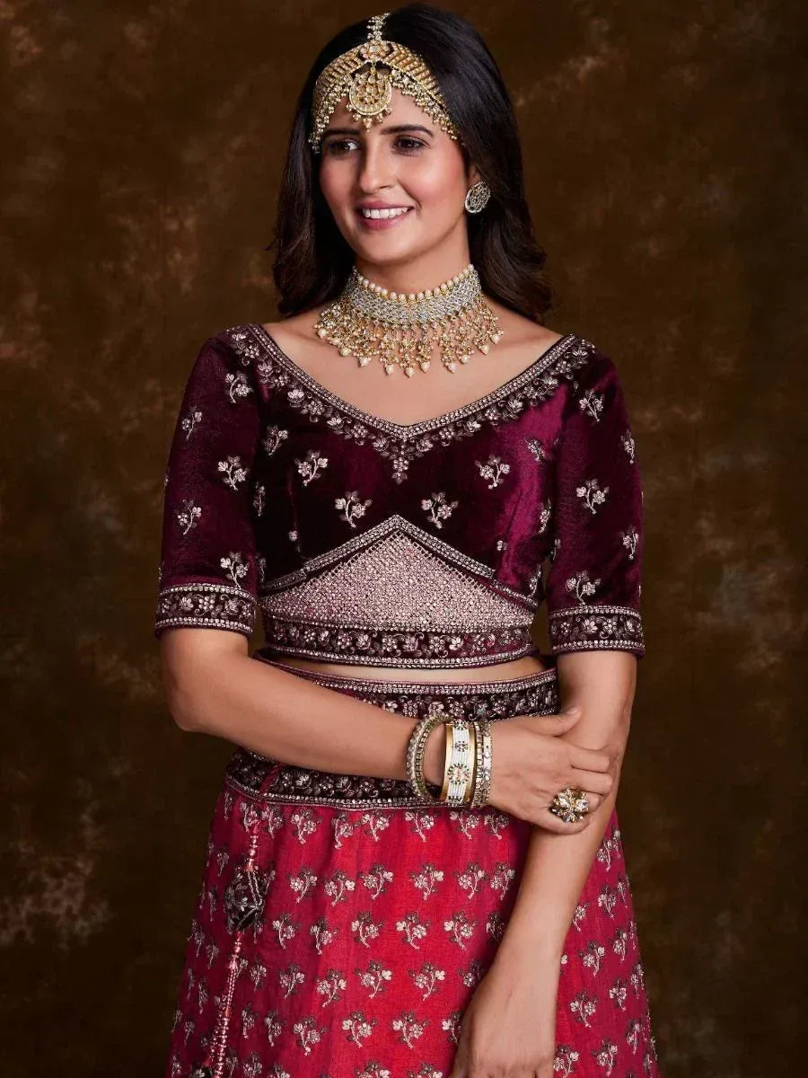 Maroon velvet lehenga choli with gold embroidery, perfect for Indian weddings and festive occasions