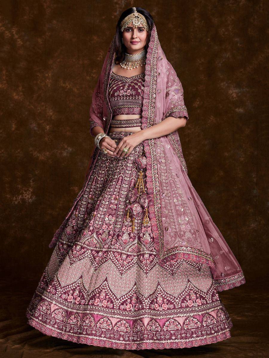 Pink embroidered lehenga choli with dupatta, traditional Indian bridal wear, intricate gold detailing