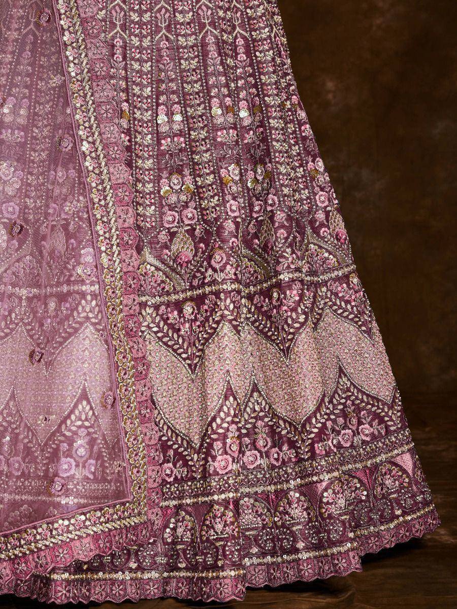 Pink and maroon embroidered lehenga with floral motifs and gold detailing, perfect for Indian ethnic wear.