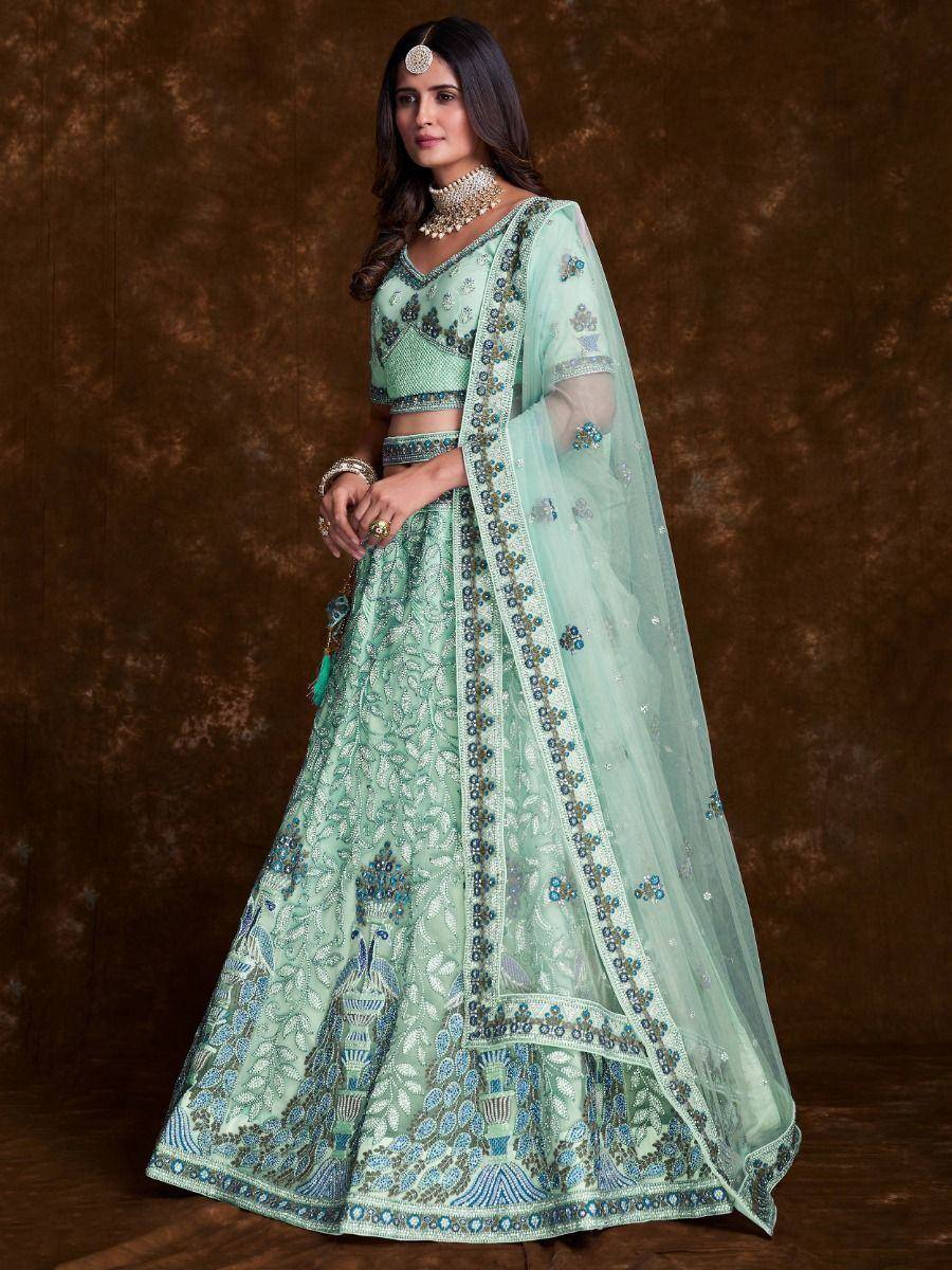 Mint green designer lehenga choli with peacock embroidery and sheer dupatta for Indian ethnic wear