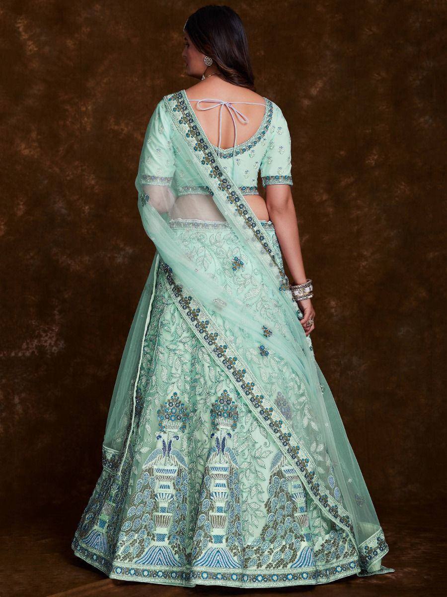 Mint green designer lehenga choli with intricate blue embroidery and back tie blouse