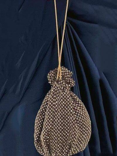 Elegant gold mesh potli bag with drawstring, perfect for ethnic wear occasions