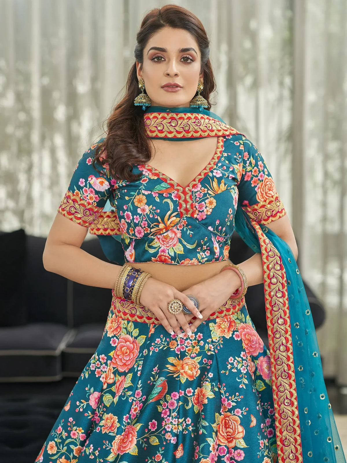 Teal floral lehenga choli with red gold border, perfect for Indian ethnic wear events