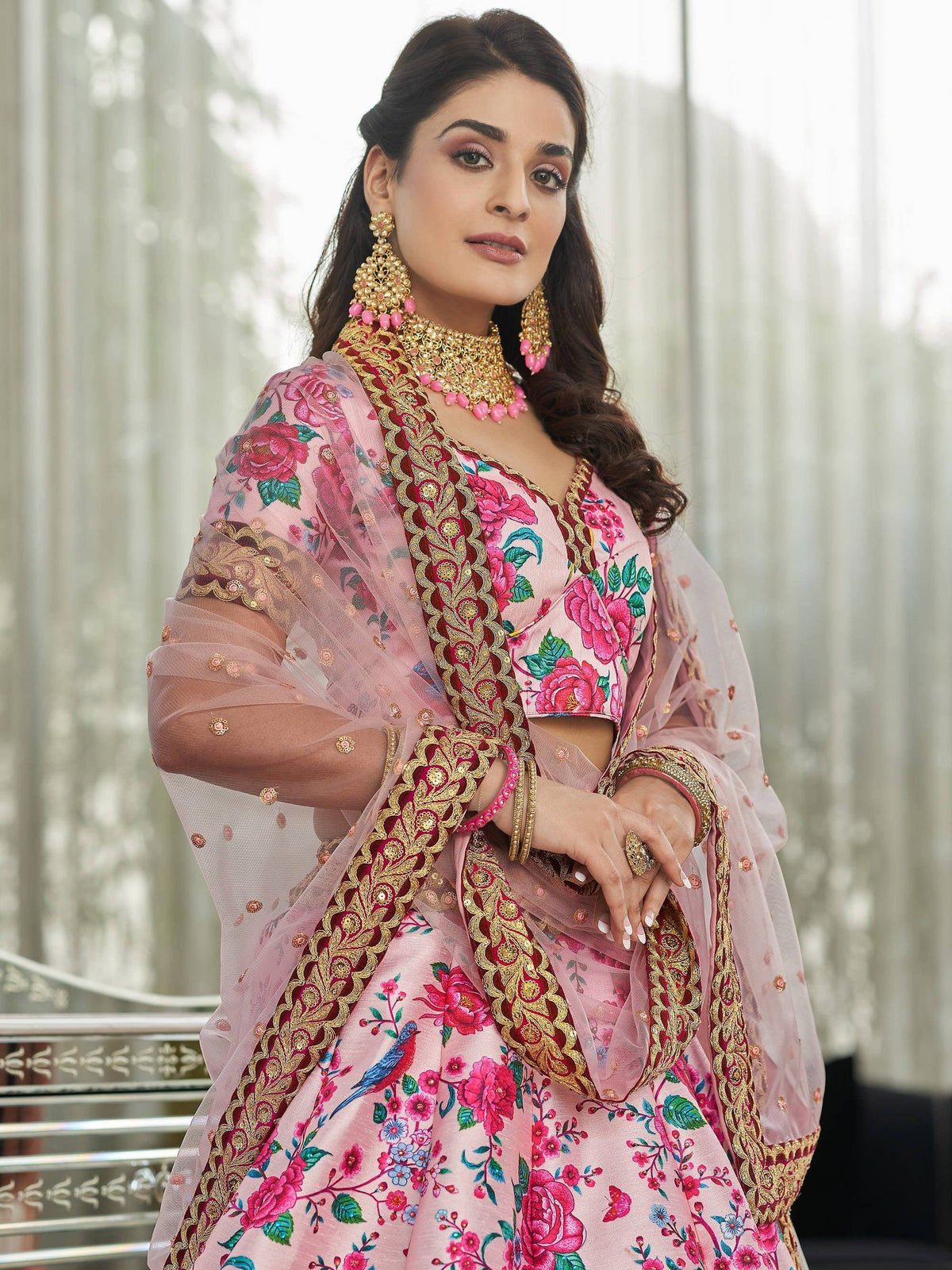 Pink floral lehenga choli with gold embroidery and sheer dupatta, perfect for Indian ethnic wear occasions.