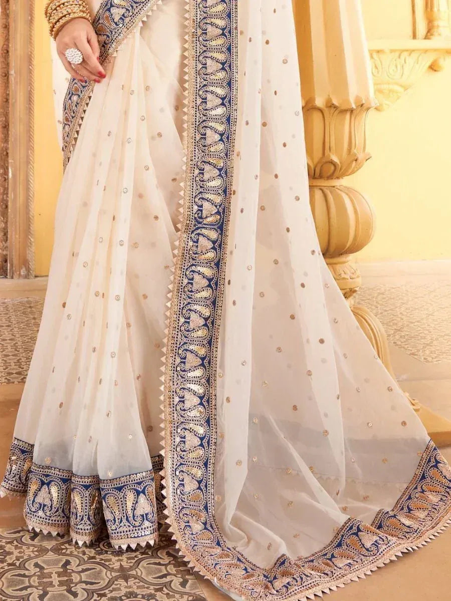 Cream saree with blue gold embroidery, designer ethnic wear for weddings