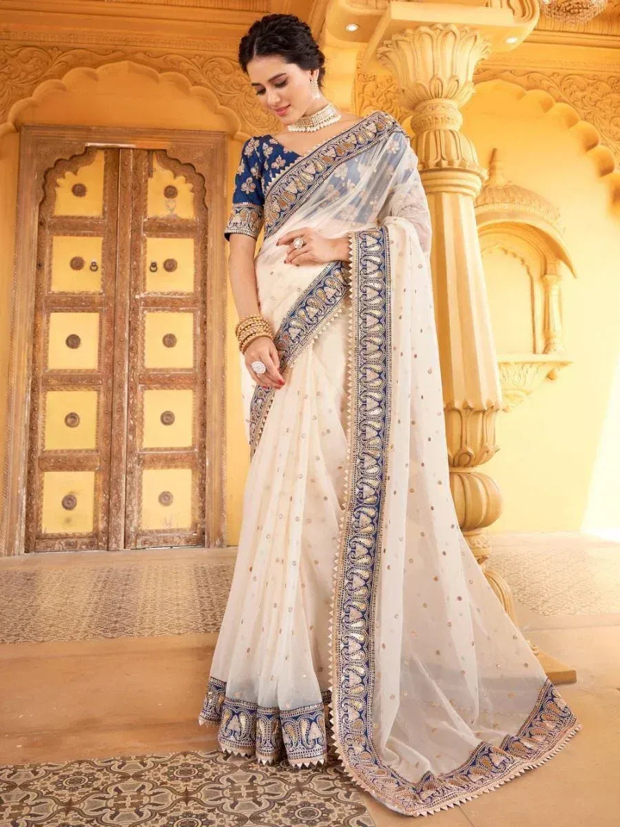 Elegant white and blue embroidered saree with designer blouse, perfect for Indian ethnic occasions