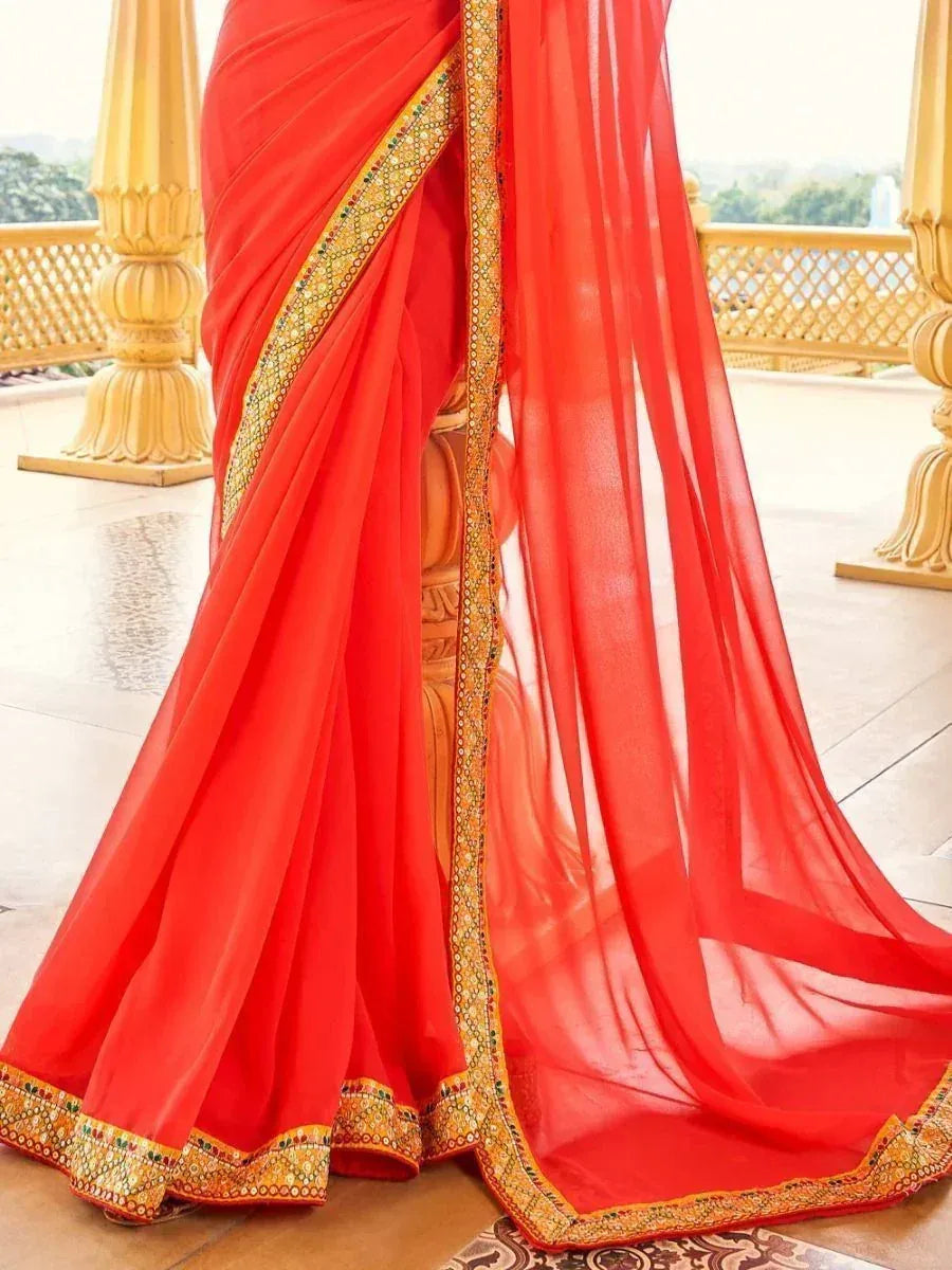 Vibrant red saree with golden embroidered border, elegant Indian ethnic wear for festive occasions