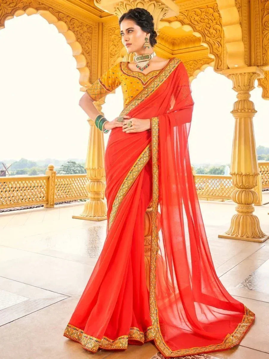 Red and gold embroidered saree with yellow blouse, styled for Indian ethnic wear