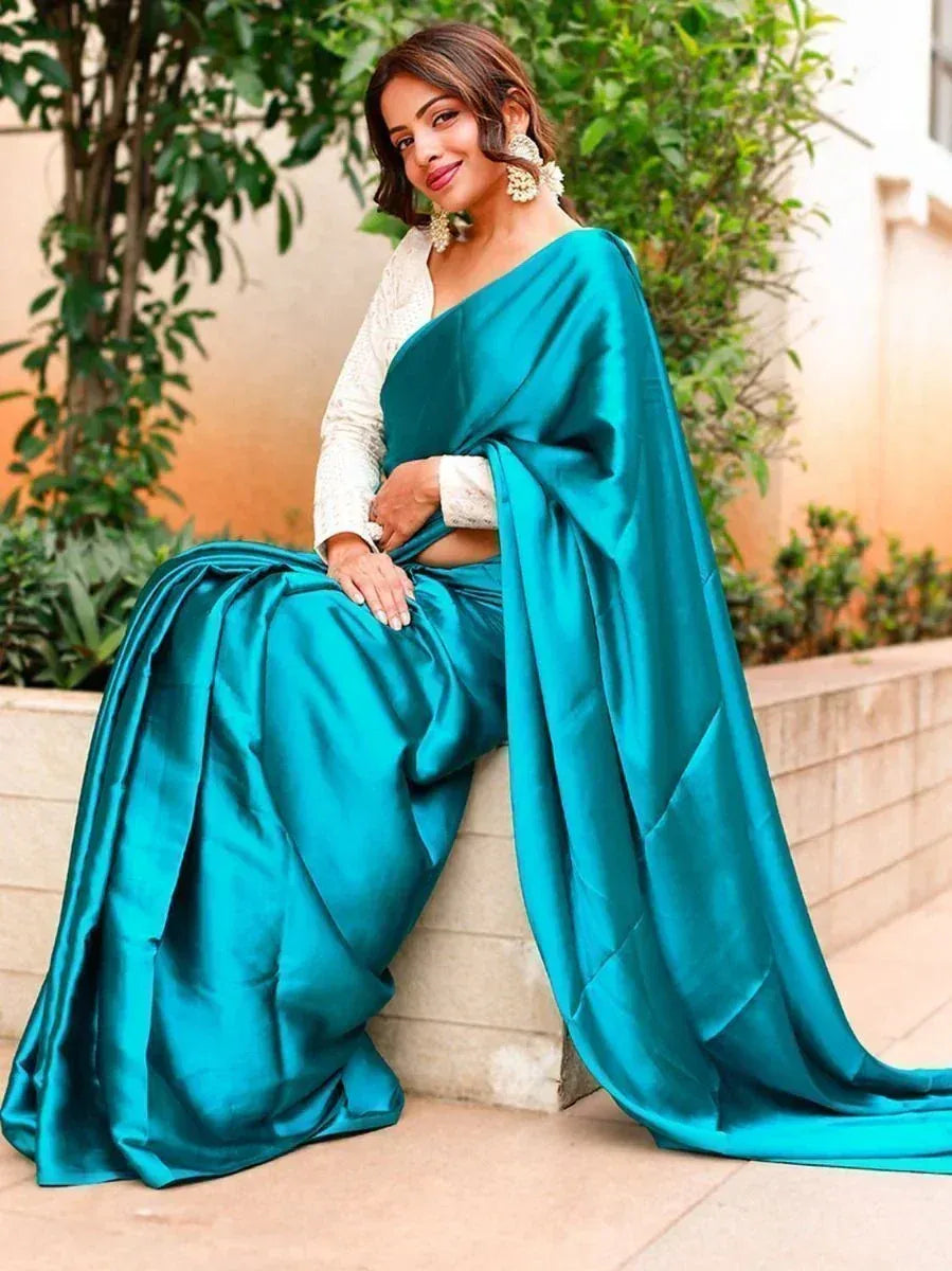 Teal satin saree with white embroidered blouse, perfect for Indian ethnic occasions