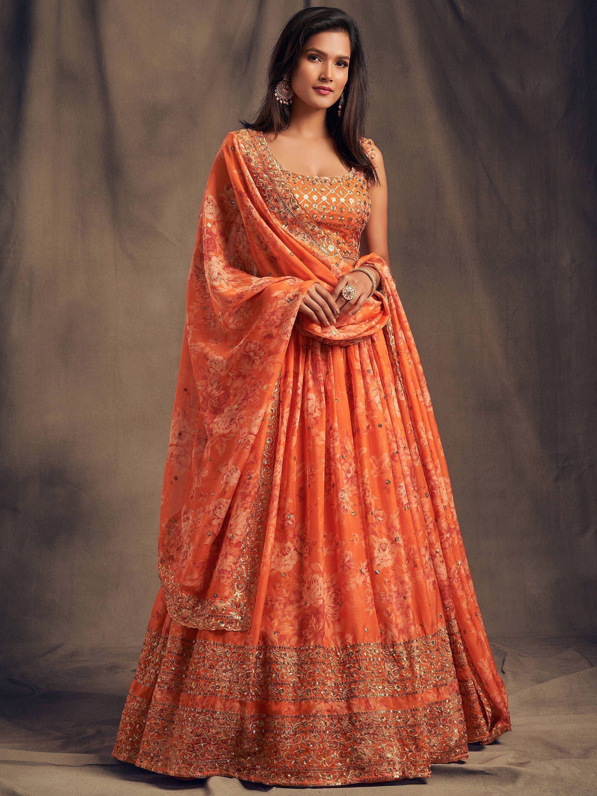 Orange floral lehenga choli with gold embroidery, perfect for Indian ethnic wear and festive occasions.
