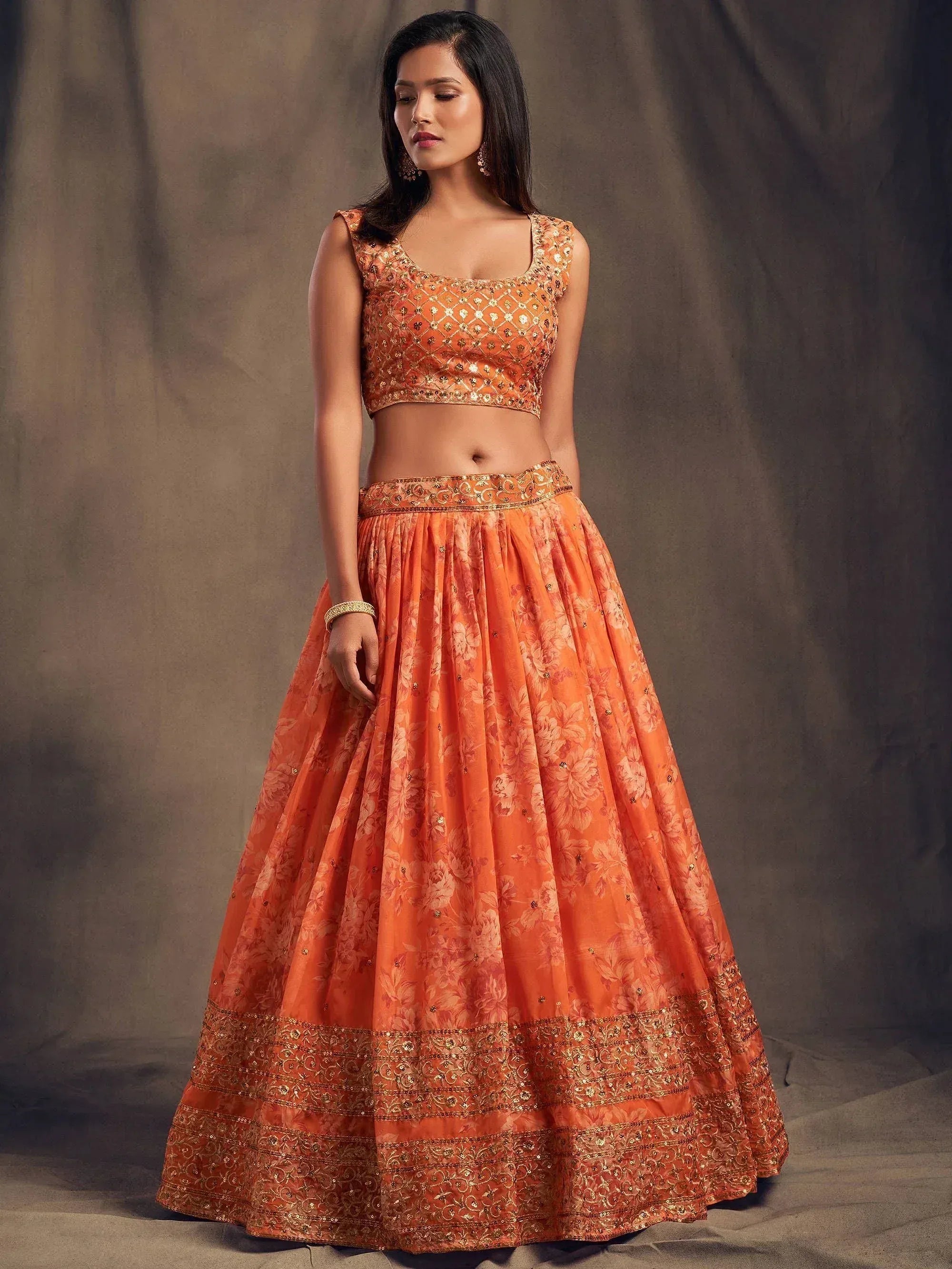 Orange floral lehenga choli with gold embroidery, perfect for Indian ethnic wear events