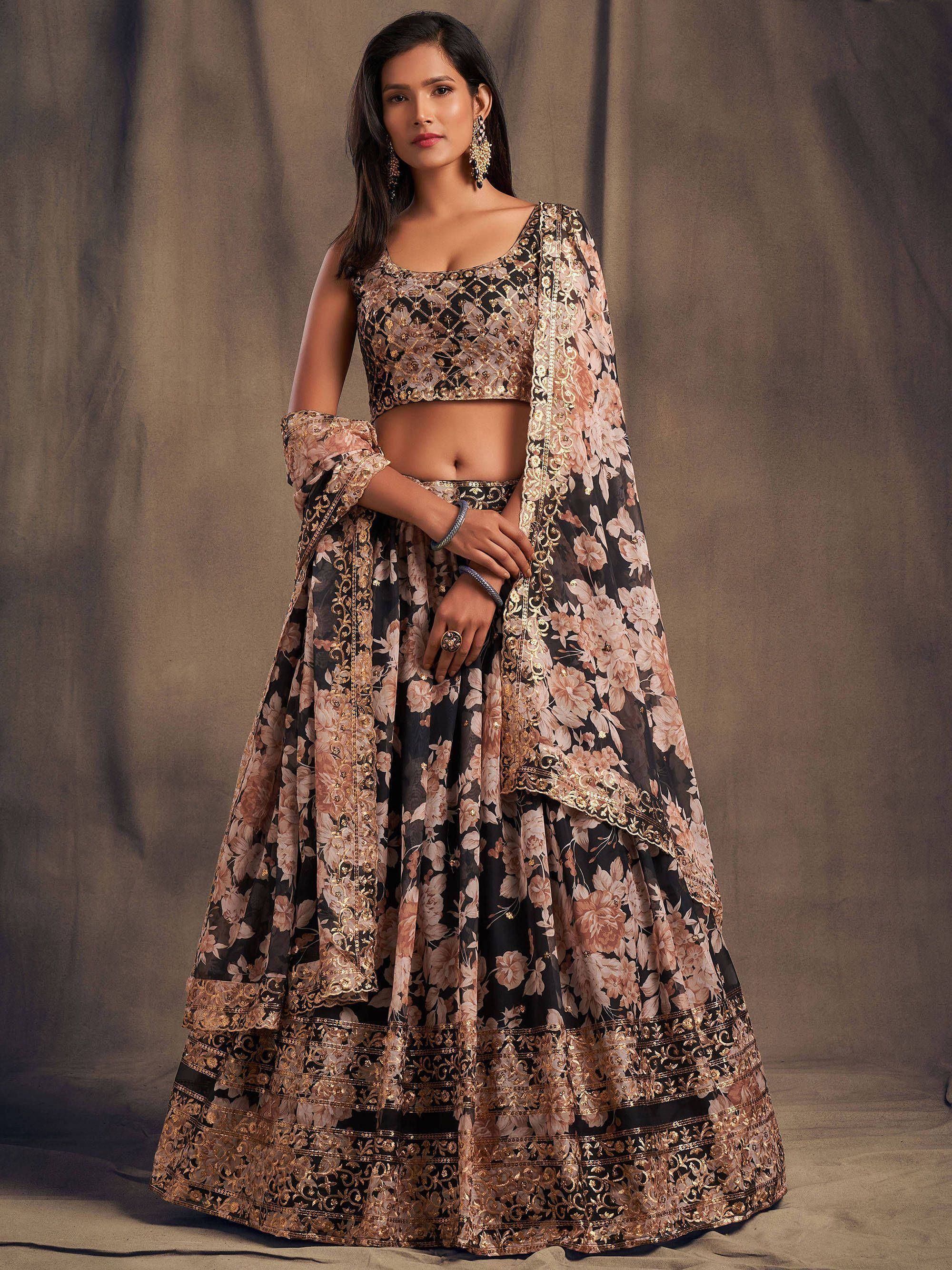 Black and gold floral lehenga choli with embroidered dupatta, perfect for Indian weddings and festive occasions.