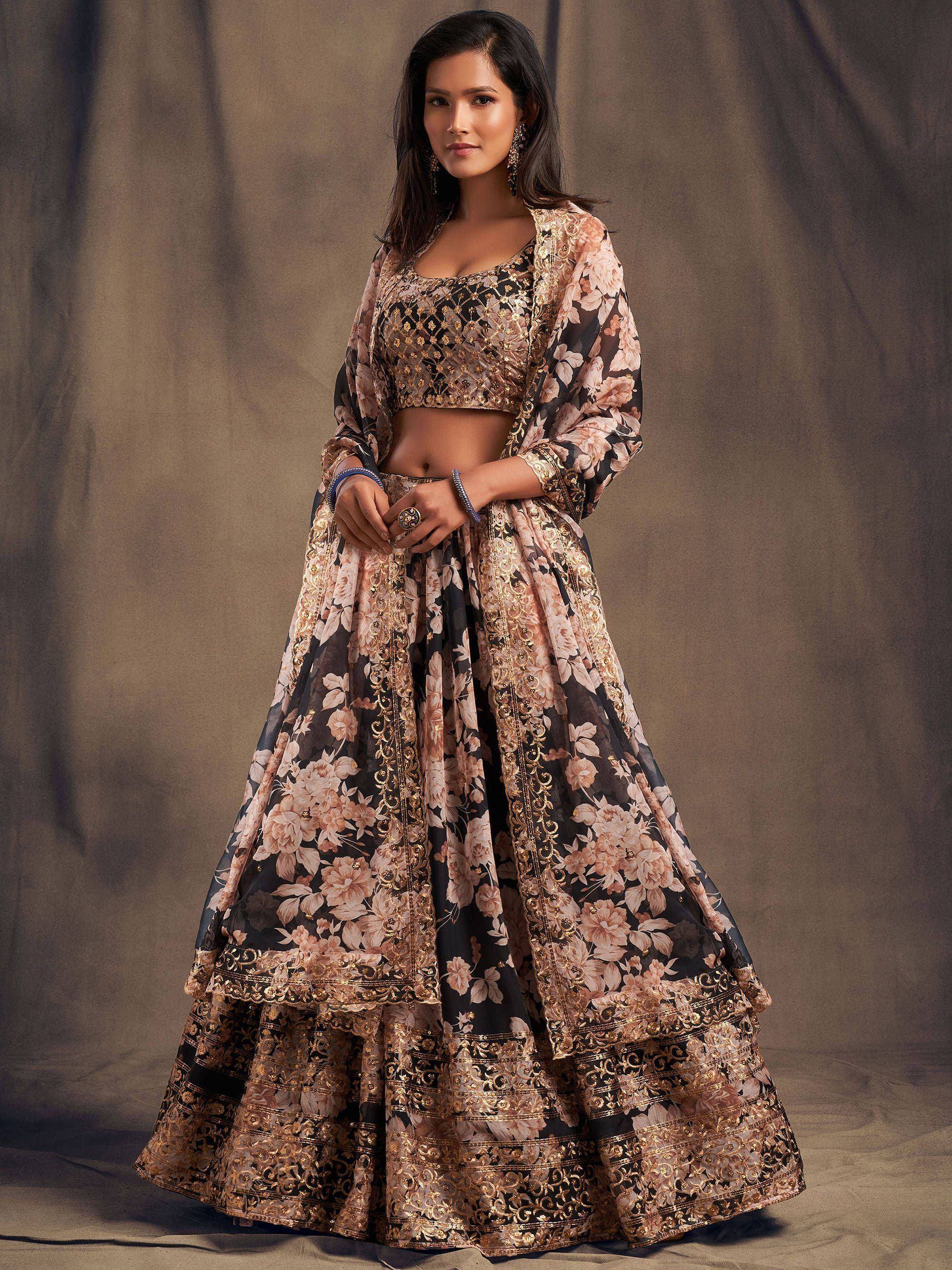 Elegant black and gold floral lehenga choli with intricate embroidery, perfect for Indian ethnic occasions.