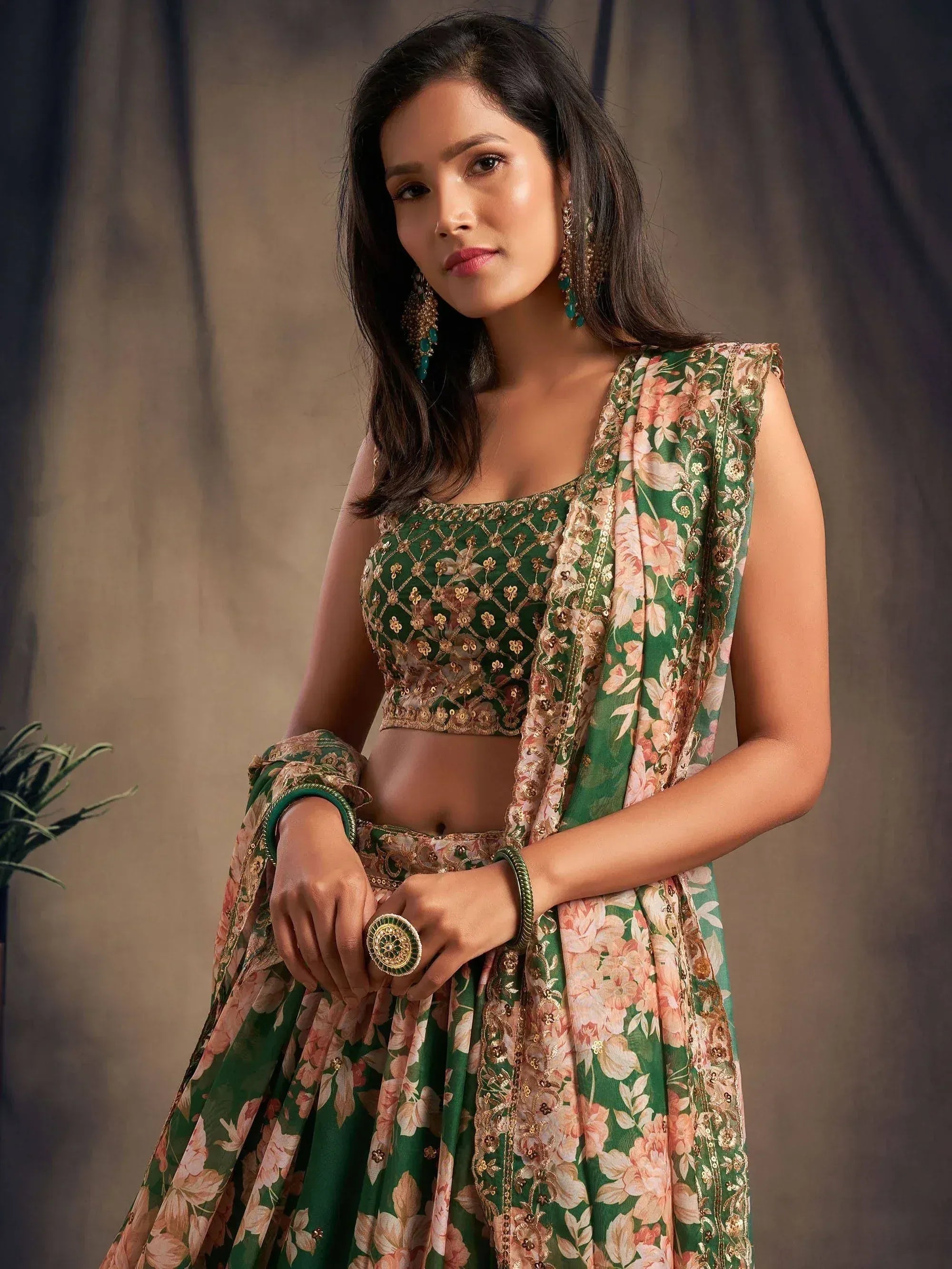 Green floral lehenga choli with gold embroidery, perfect for Indian ethnic wear and festive occasions.