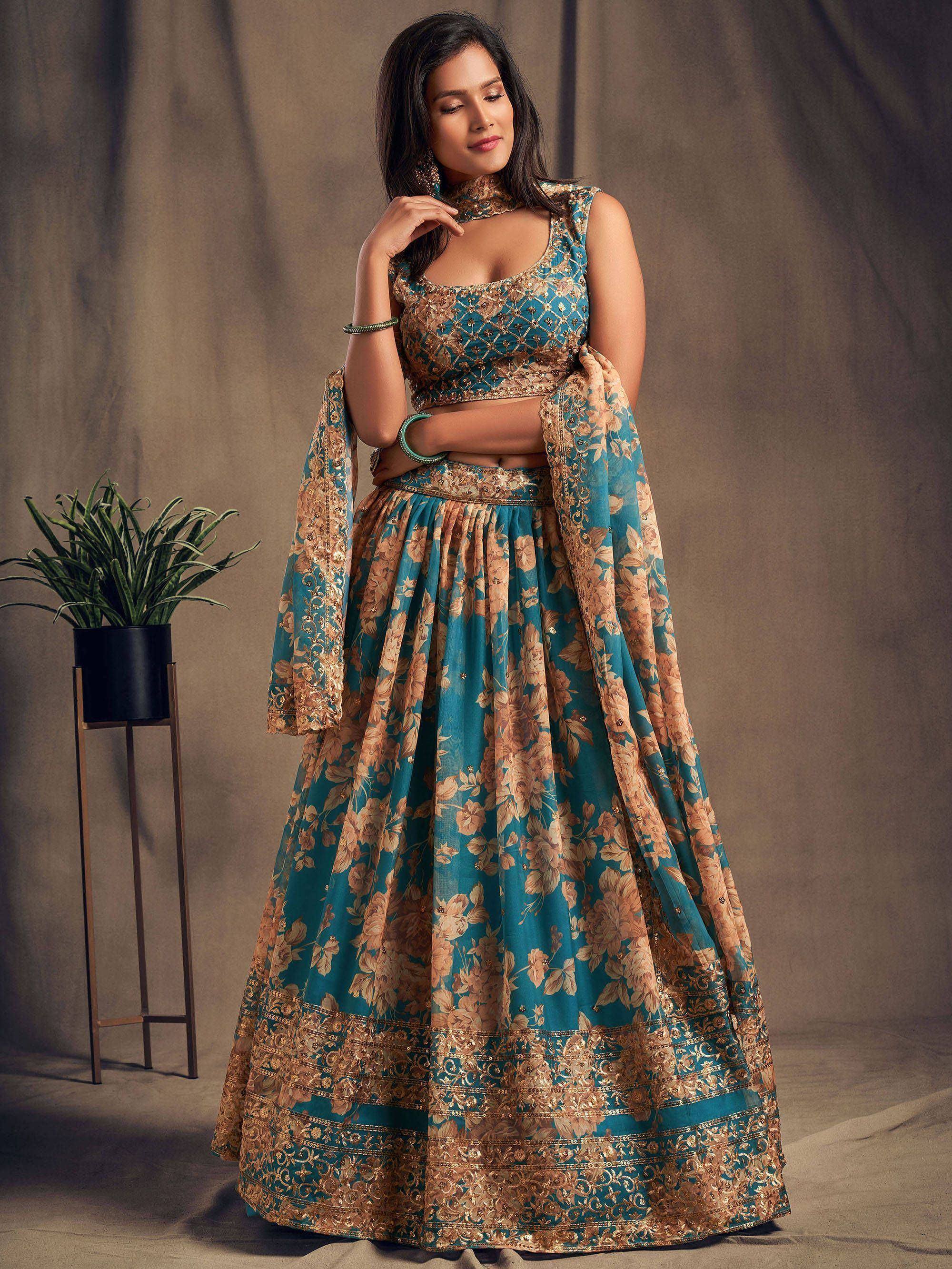 Teal and gold floral lehenga choli with intricate embroidery, perfect for Indian ethnic occasions