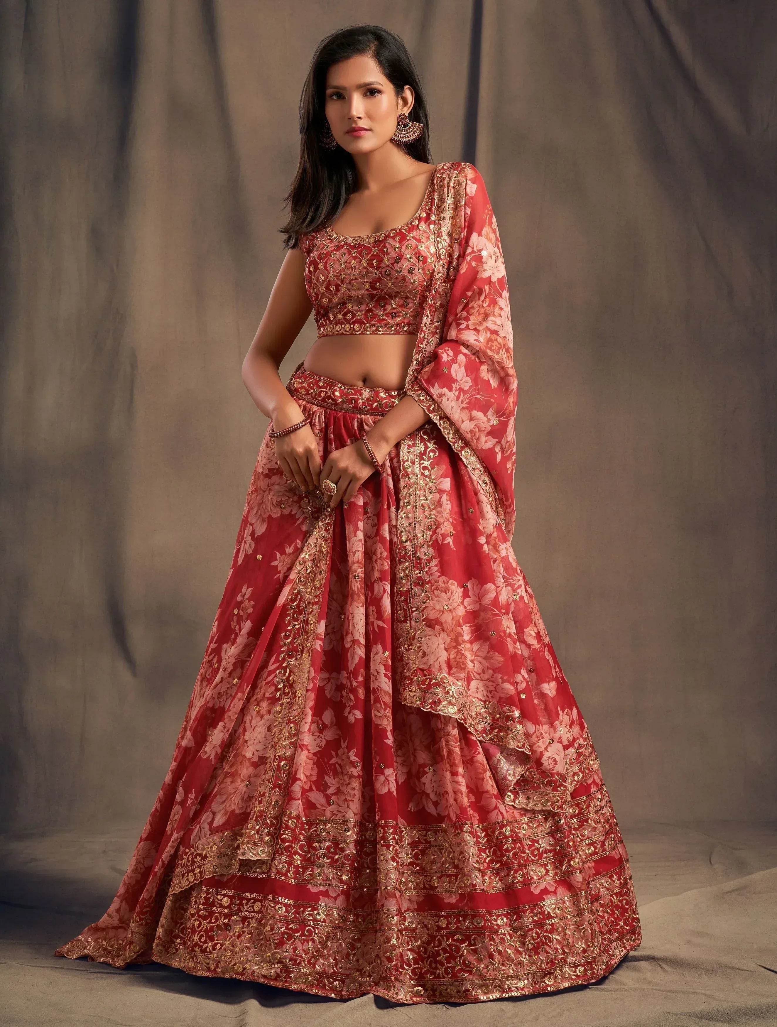 Red floral lehenga choli with gold embroidery, perfect for Indian weddings and festive occasions