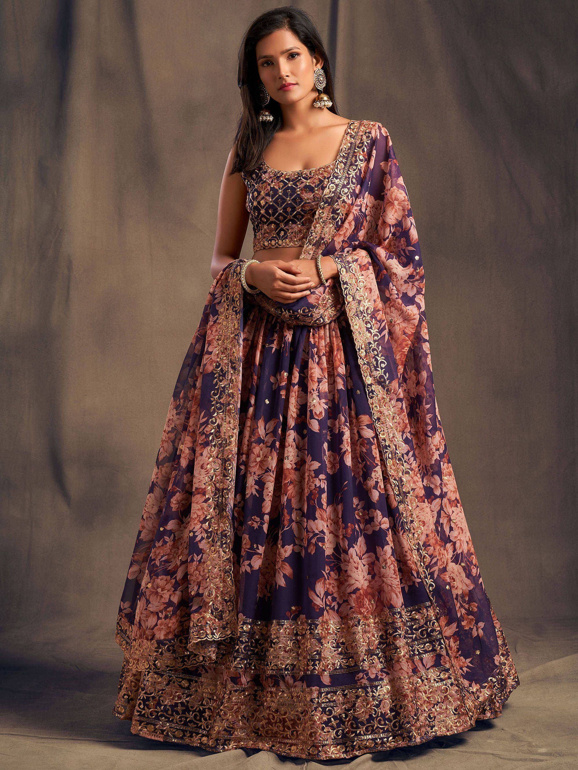 Purple floral lehenga choli with gold embroidery, perfect for Indian weddings and festive occasions