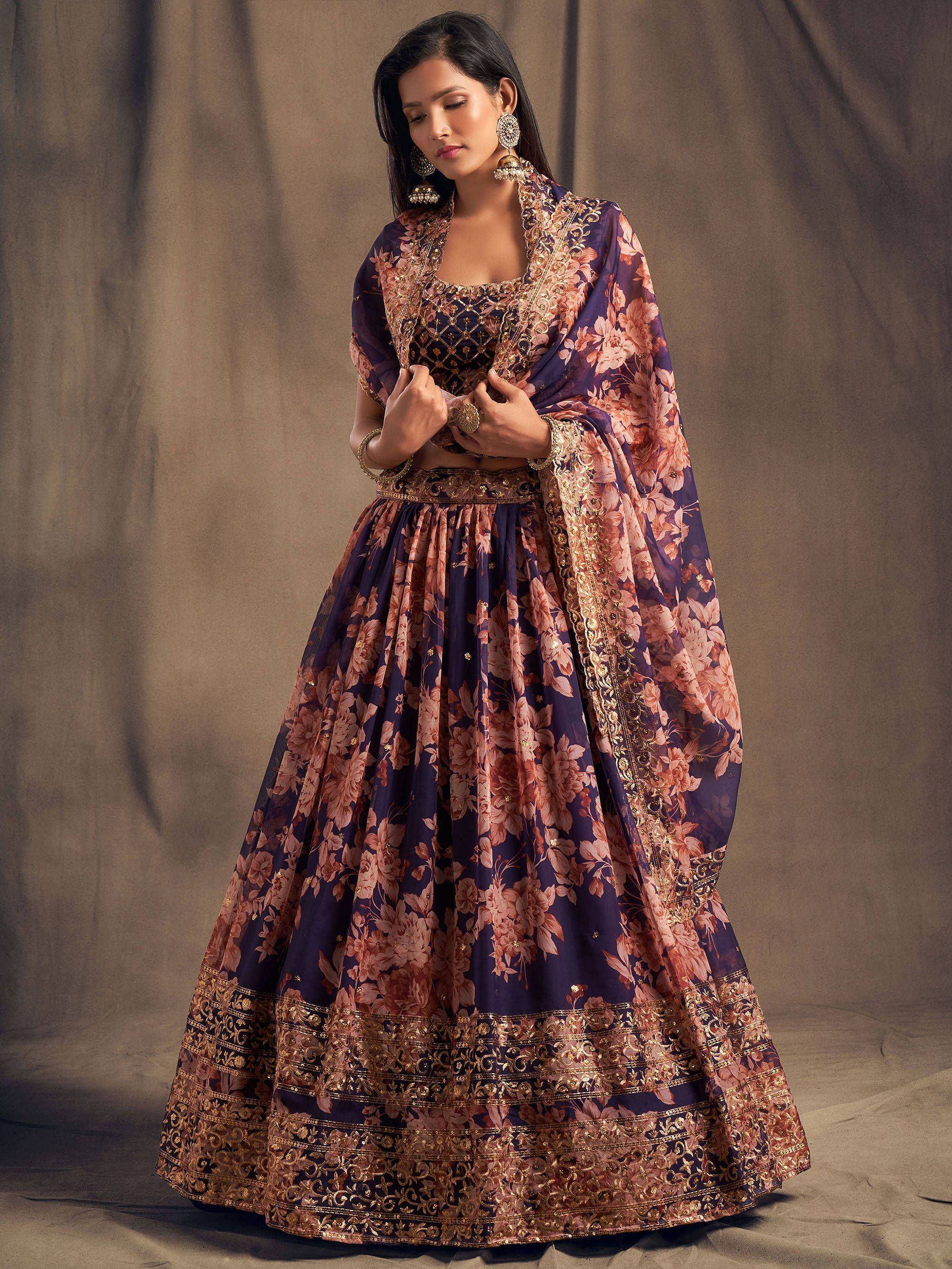 Purple floral lehenga choli with gold embroidery, perfect for Indian weddings and festive occasions.
