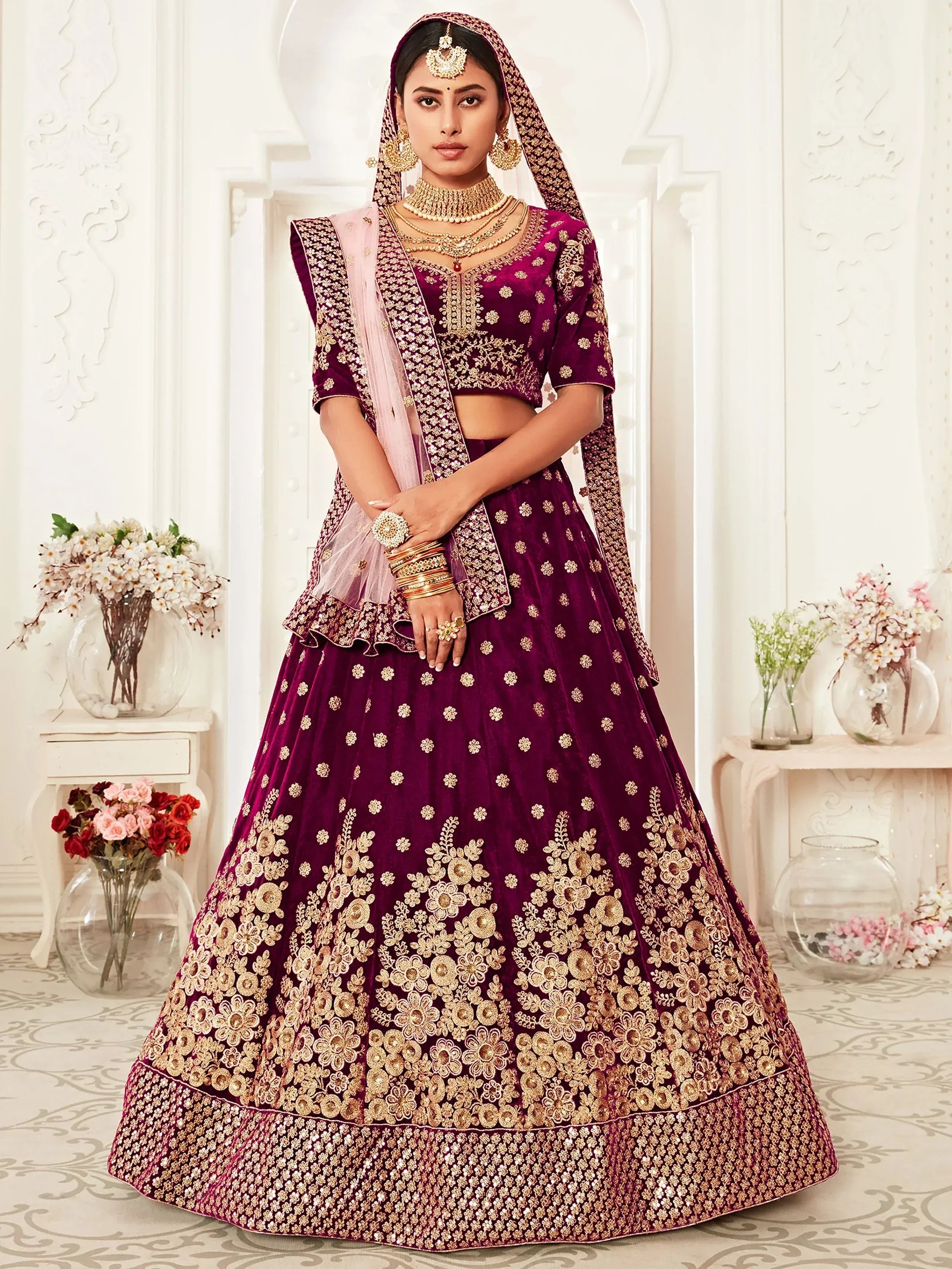 Purple velvet bridal lehenga choli with gold floral embroidery and matching dupatta for Indian weddings