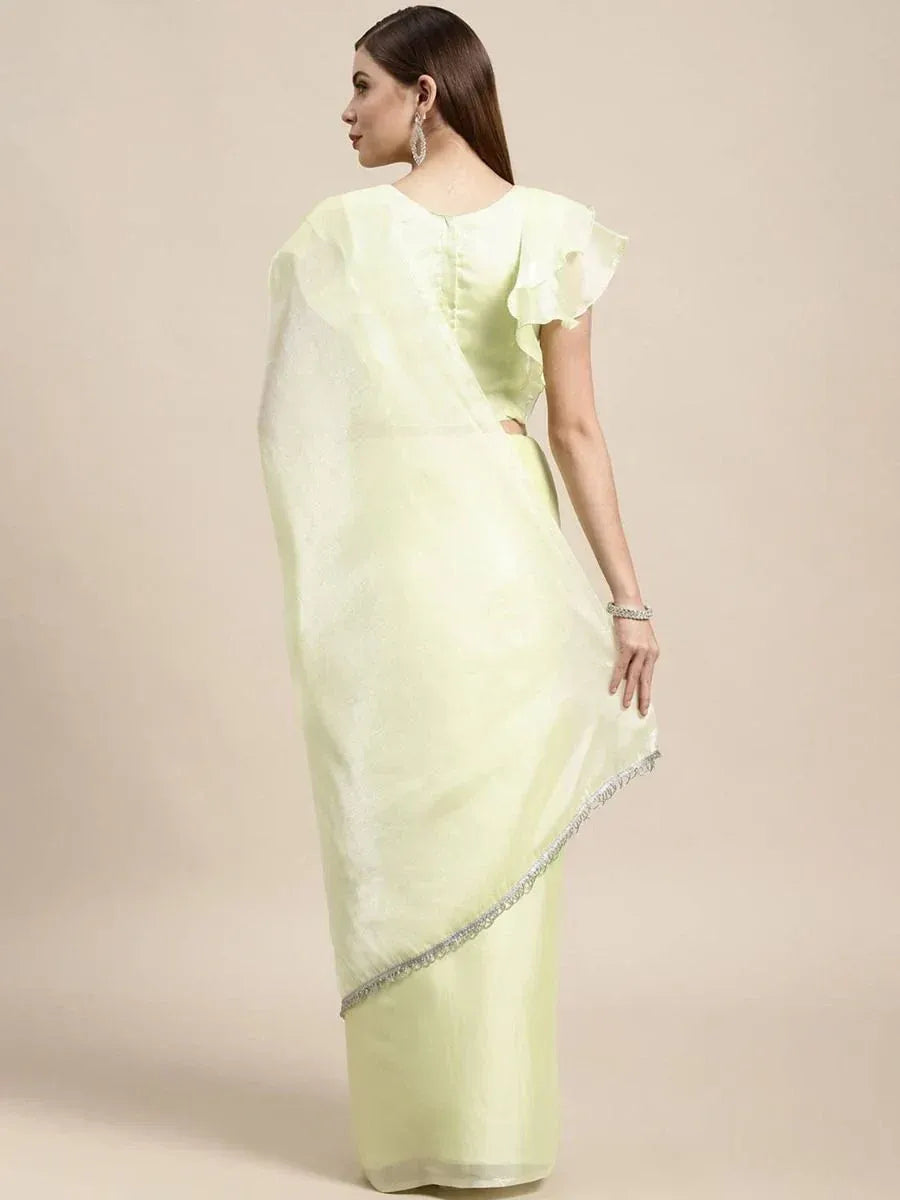Light green saree with ruffle sleeve blouse and silver border, elegant ethnic wear for women