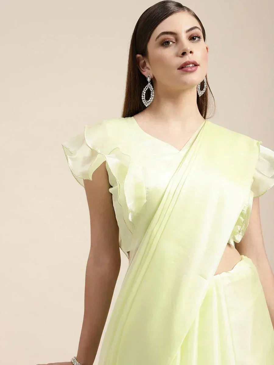Light green saree with ruffle sleeves, elegant ethnic wear for women