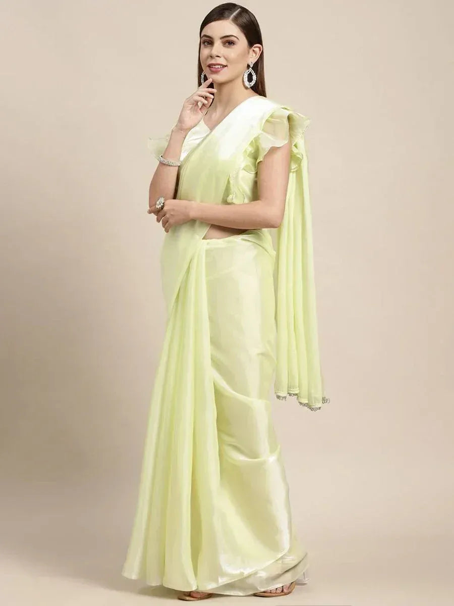 Light green satin saree with ruffled blouse, perfect for Indian ethnic wear occasions