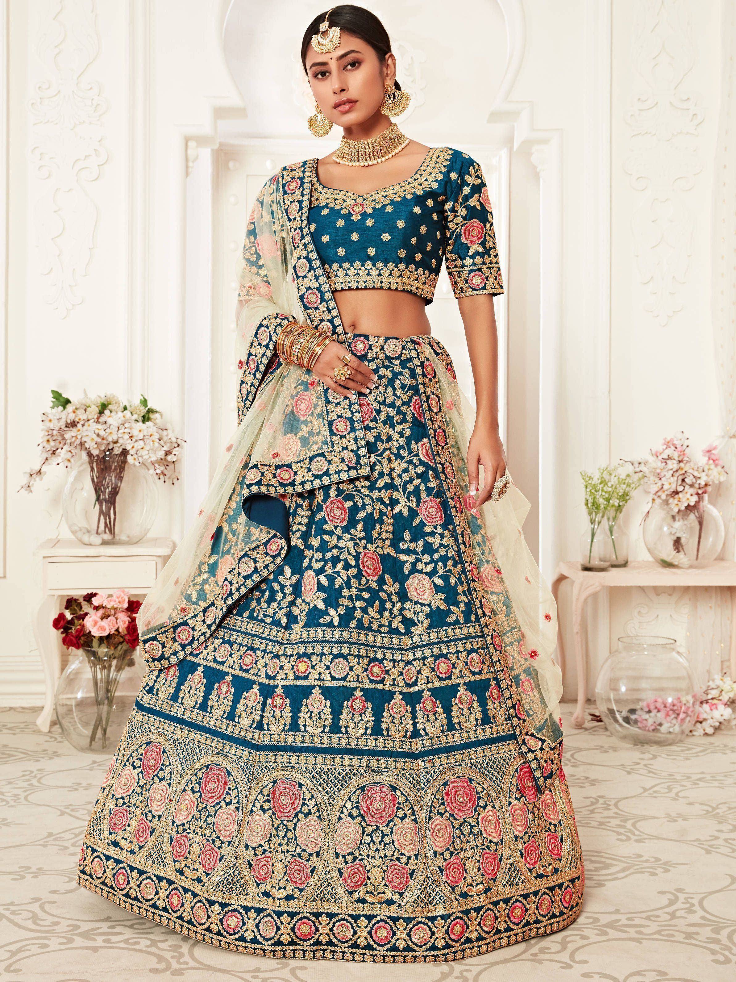 Blue floral embroidered lehenga choli with gold detailing, perfect for Indian weddings and festive occasions.