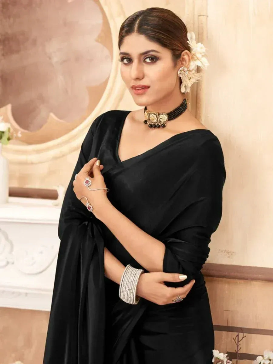 Elegant black saree with designer jewelry, perfect for Indian ethnic occasions