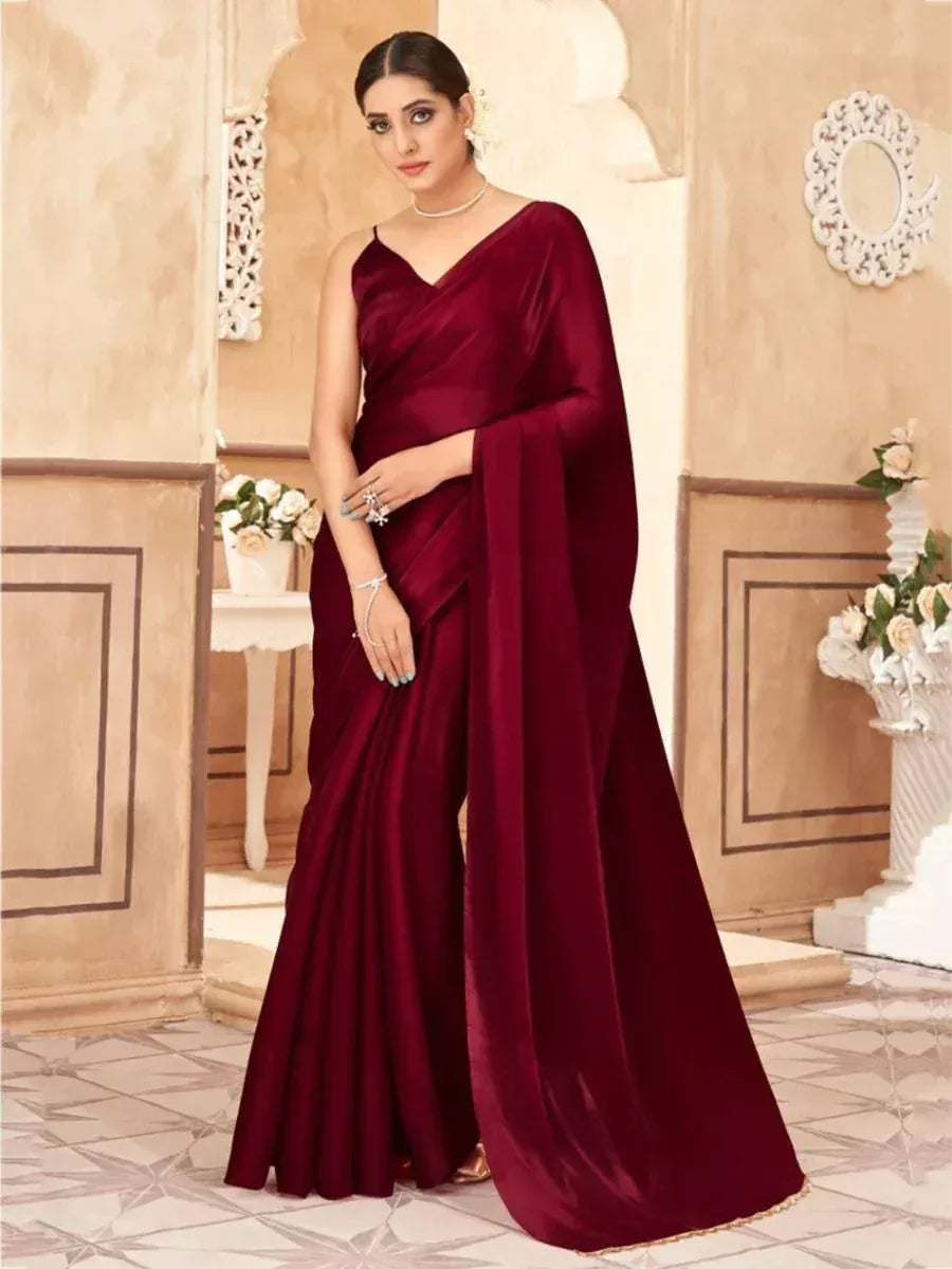 Elegant maroon velvet saree with V-neck blouse, perfect for Indian ethnic occasions and festive wear.