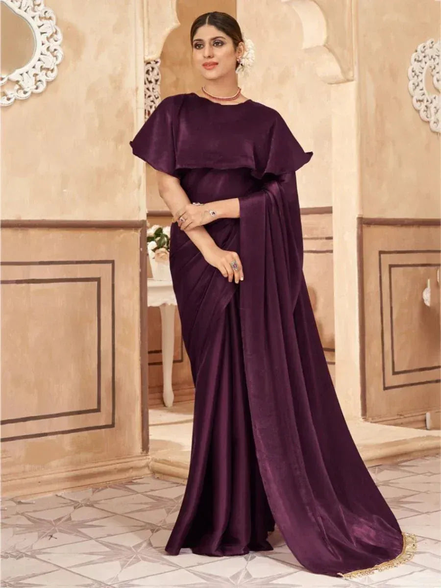 Elegant purple satin saree with cape-style blouse, perfect for Indian ethnic occasions and festive wear.