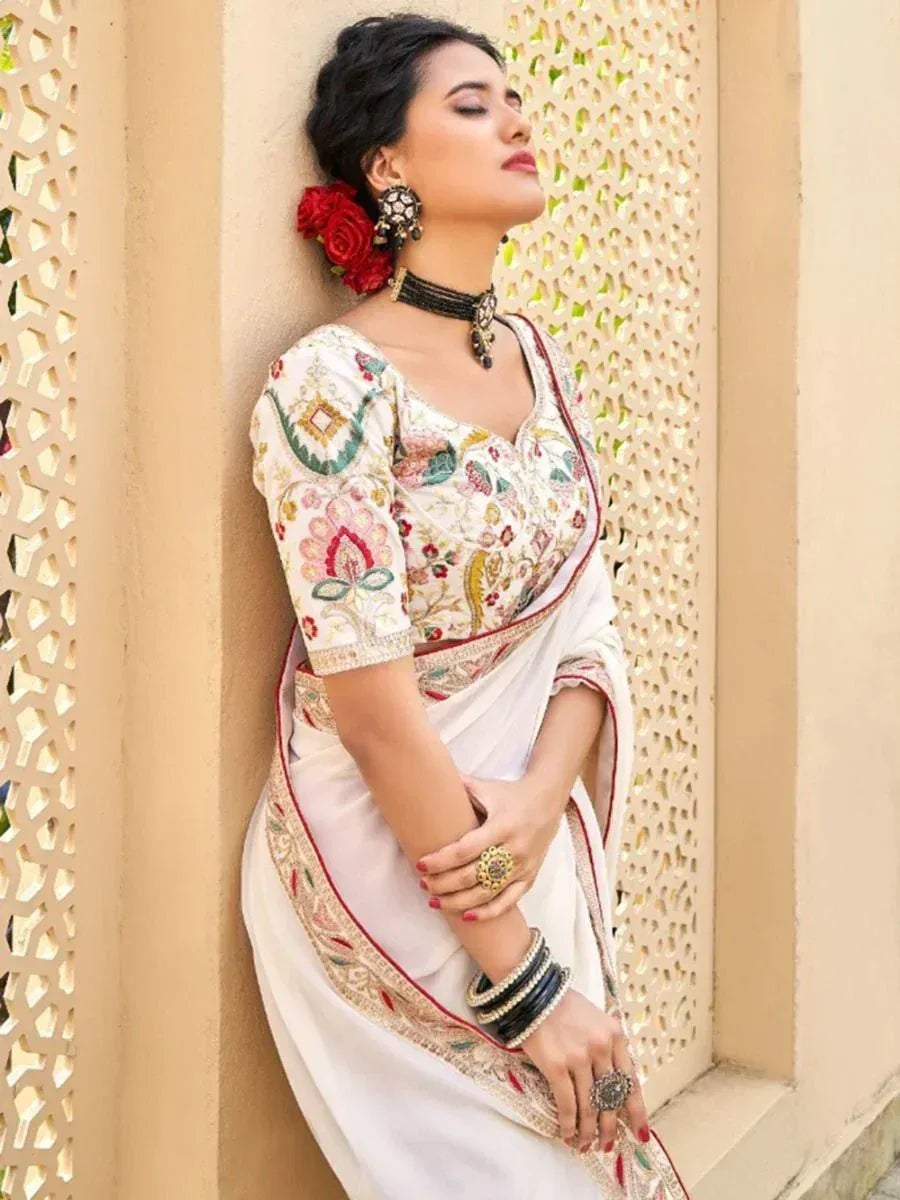 Elegant white embroidered saree with floral blouse, perfect for Indian ethnic occasions
