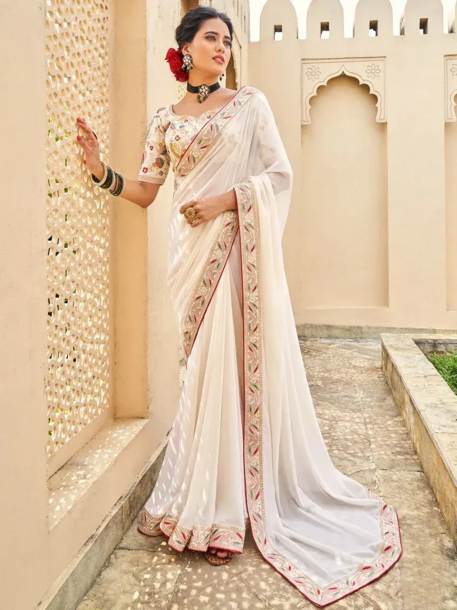 Elegant white embroidered saree with floral border, perfect for Indian ethnic occasions