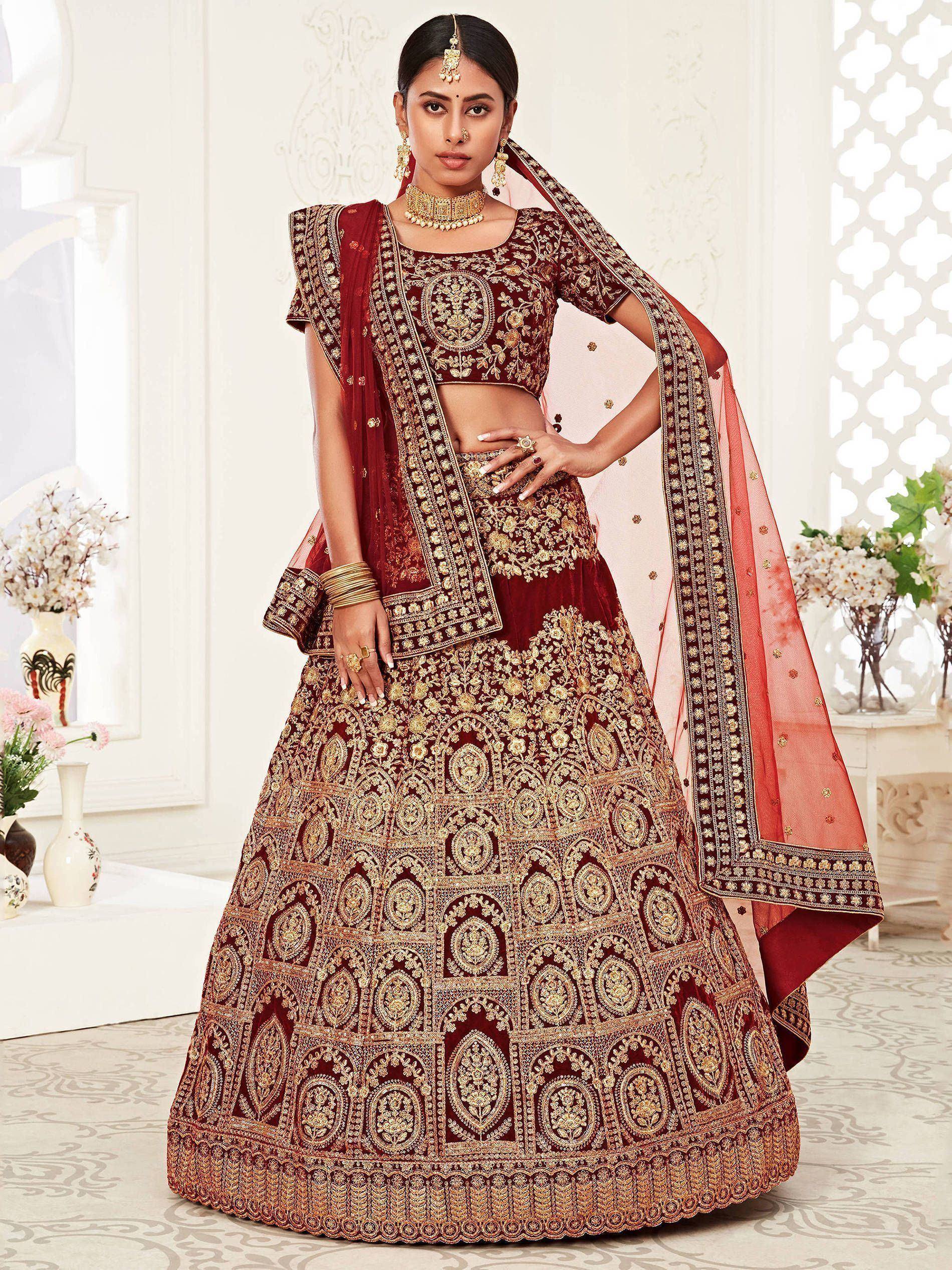 Maroon designer lehenga choli with heavy gold embroidery and matching dupatta for Indian weddings